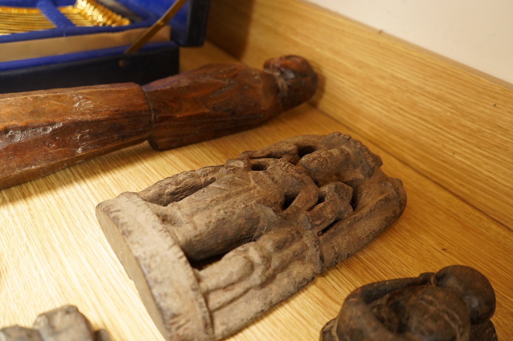 A group of Indian carved figures of deities, largest 42.5cm